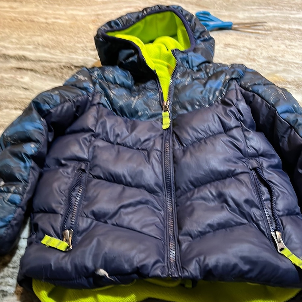 A boys jacket, sized 4t in good condition. Blue with splashes of.grey